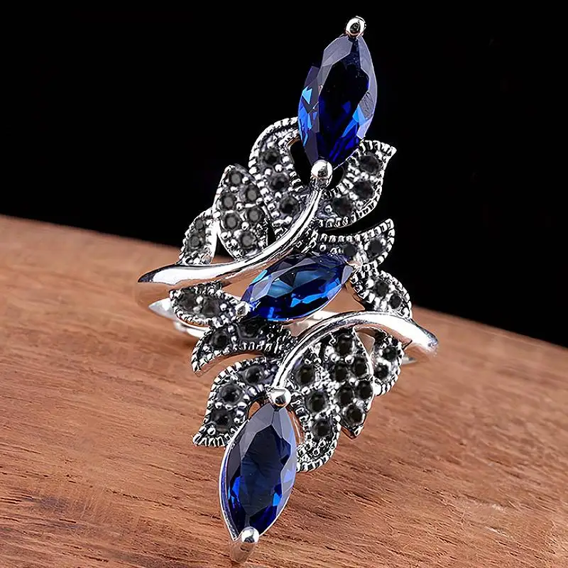 Huitan Damen-Ring im Marquise-Design mit offener Fassung, eingelegt mit leuchtend schwarzem/blauem CZ, elegantes Hochzeitszubehör, trendiger Partyschmuck
