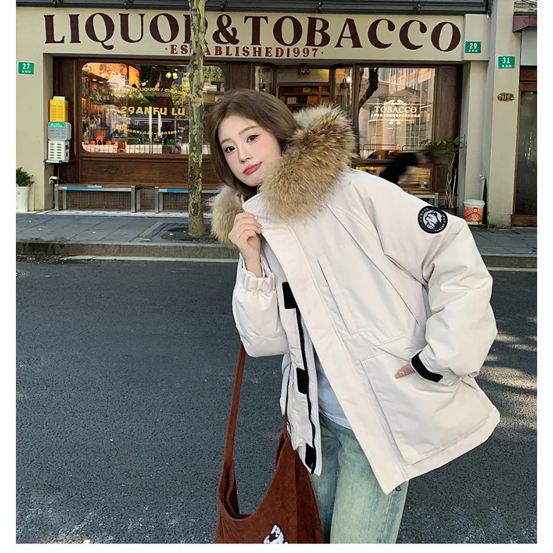 النساء 2025 الشتاء عادية فضفاض دافئ معطف مبطّن بالقطن زوجين سترة البضائع الفراء طوق سميكة أسفل سترة الملابس المبطنة بالقطن