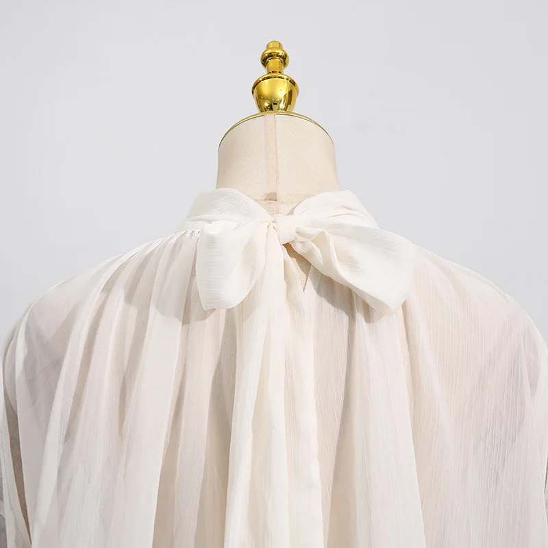 New style of the fashion season - elegant and stylish netted sleeveless top with wooden earflaps and long sleeves