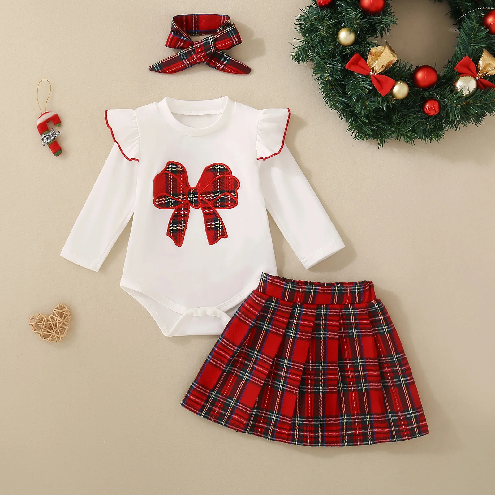Spring/Autumn-style two-piece set for baby girls and young children, comprising a long-sleeved bodysuit with a bow and a skirt