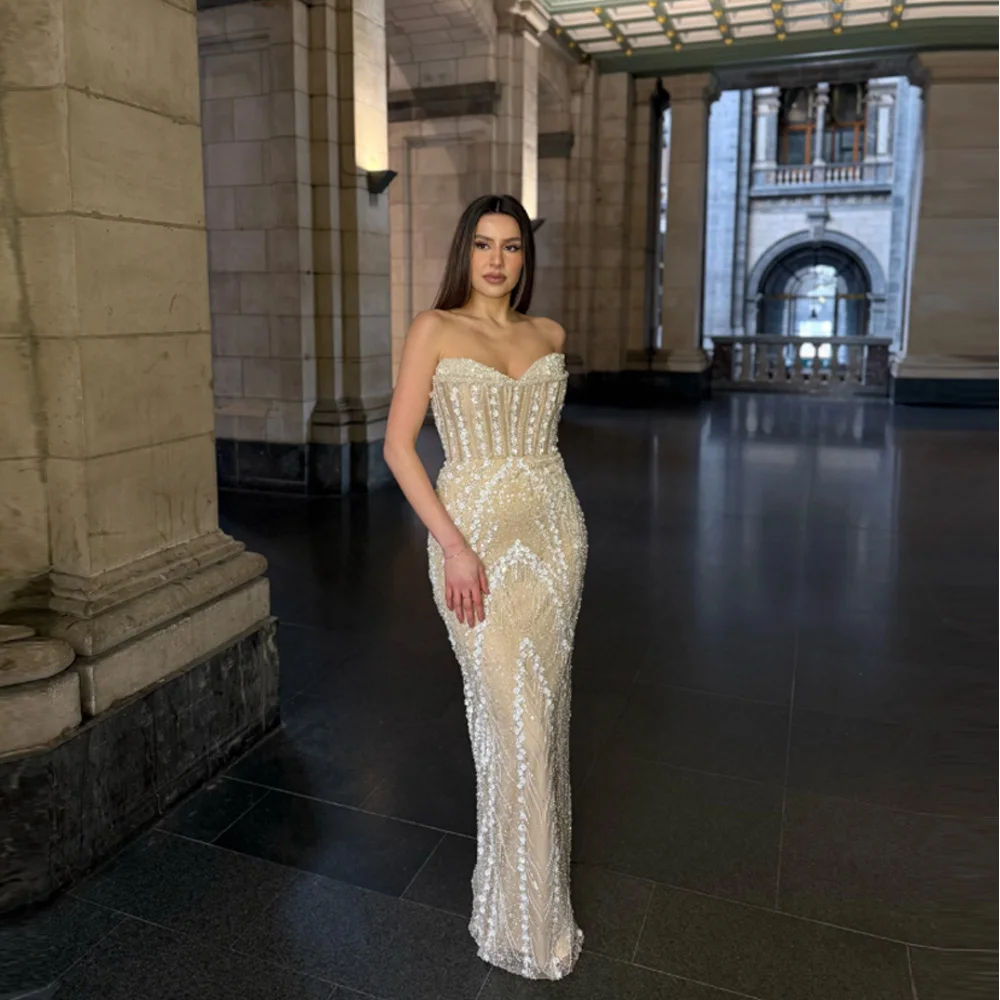 Custom-made, backless, strapless mermaid wedding dress featuring an elegant train—perfect for a birthday party or wedding.