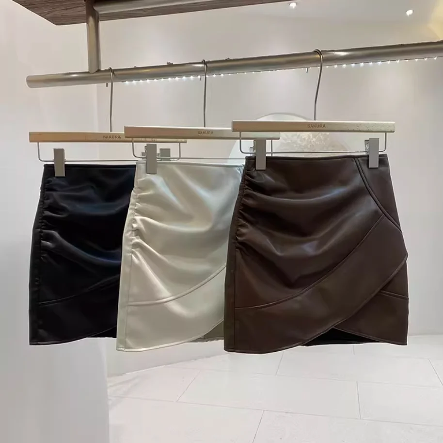 Nueva moda Otoño/Invierno Sexy cintura alta PU Color sólido Slim Fit cintura elástica por encima de la rodilla Mini falda para mujer, 3 colores