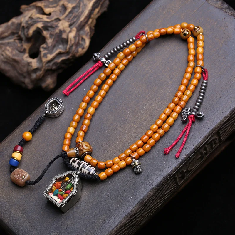 Hand-Held 108-Bead Buddhist Prayer With Beads, Copper Gahu Box, Zaki Lhamo Pendant, And Yak Bone Three-Way