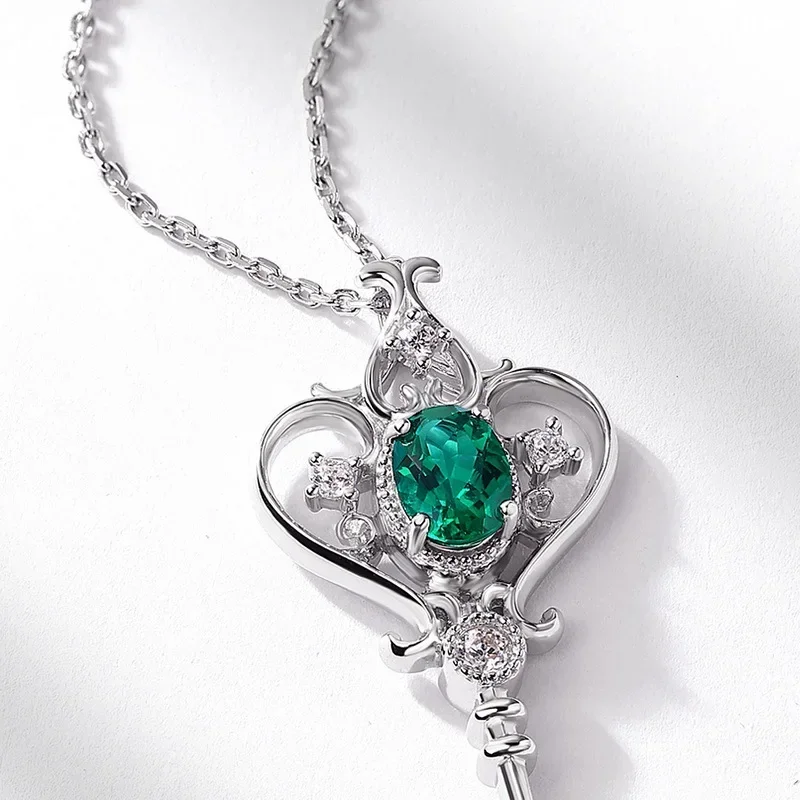 S925 الفضة مطلي 18K الذهب PT950 البلاتين الأوريول الذيل زهرة المرأة زراعة اليشم مفتاح قلادة