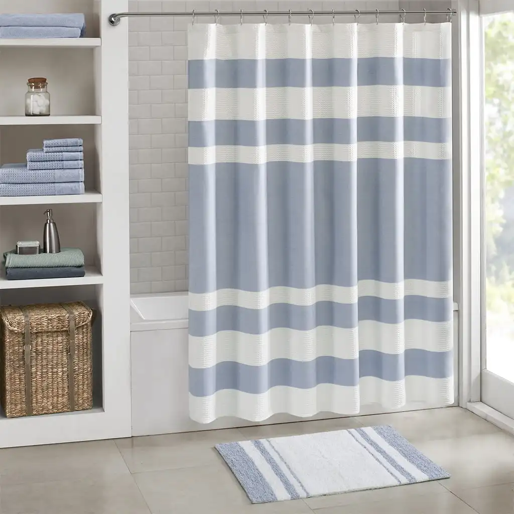 

Medium pile cotton reversible bath rug with non-slip backing in blue measuring 20 inches wide by 30 inches long