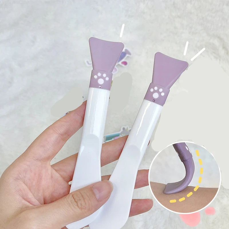 Raspador aplicador de mascarilla Facial de silicona, cepillo facial de pata púrpura, herramientas de cuidado de la piel DIY de belleza de doble cabeza, 1 ud.