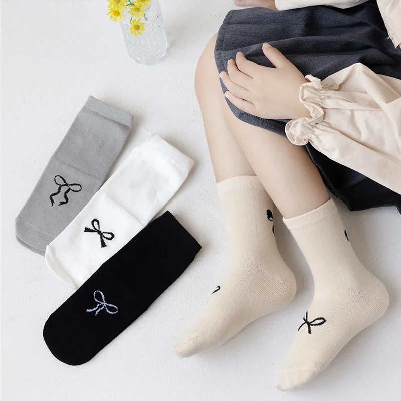 

Four pairs of girls' soft and comfortable socks with cute bows for spring and autumn; versatile and sweet Korean style