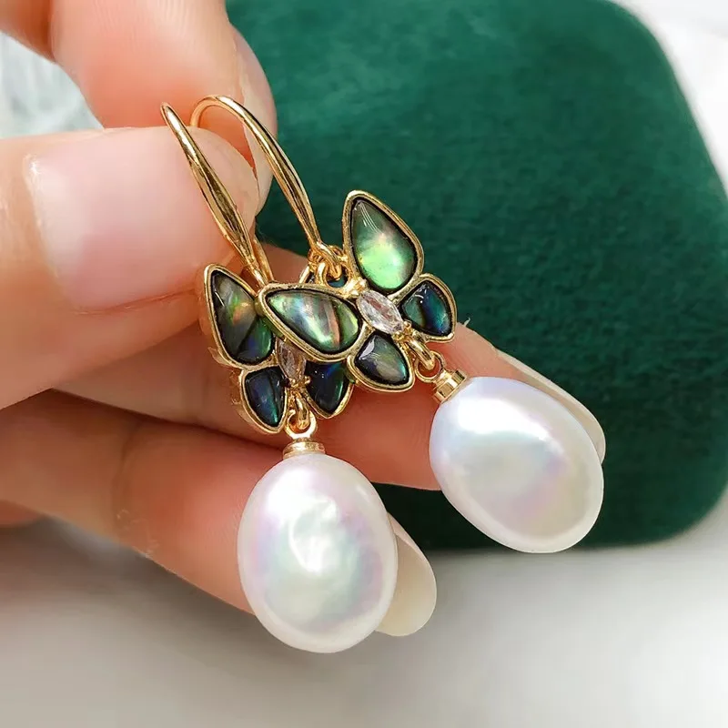 freshwater pearl white oval  and abalone shell butterfly earrings  FPPJ