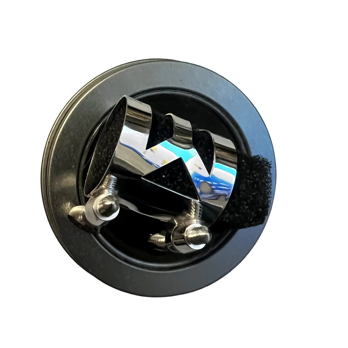 Selmer tenor saxophone metal ligature, mirror-polished stainless steel, stabilizes airflow.