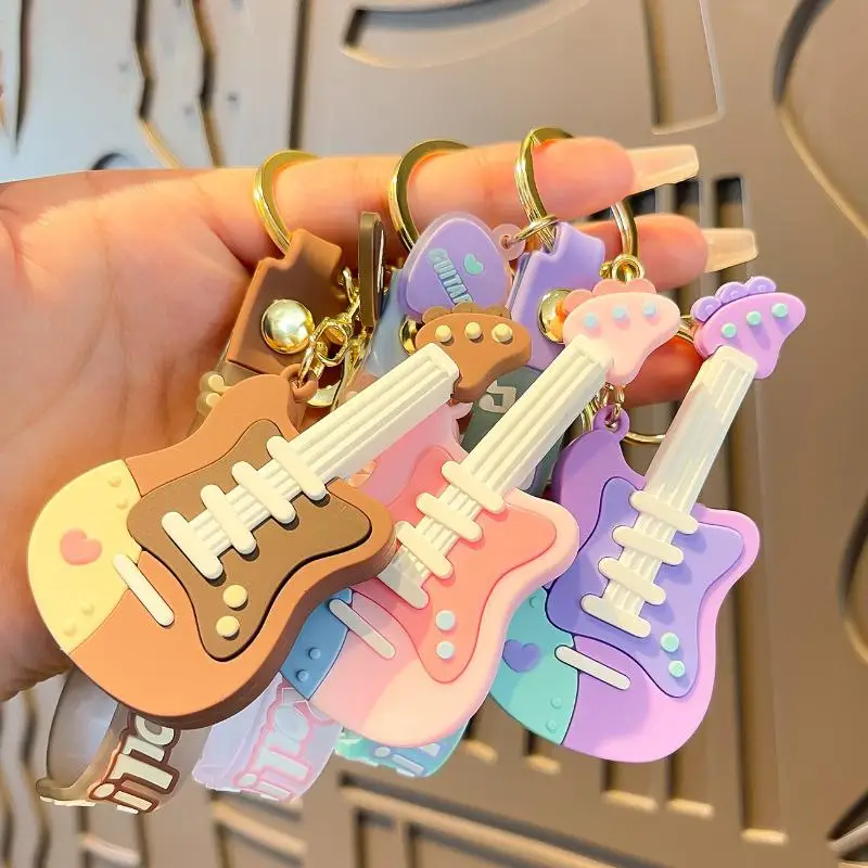 Niedlicher Cartoon-Gitarren-Schlüsselanhänger aus Silikon mit Handschlaufe, Pastell-Design für Taschendekoration, Geschenk für Musikliebhaber – Detail 2