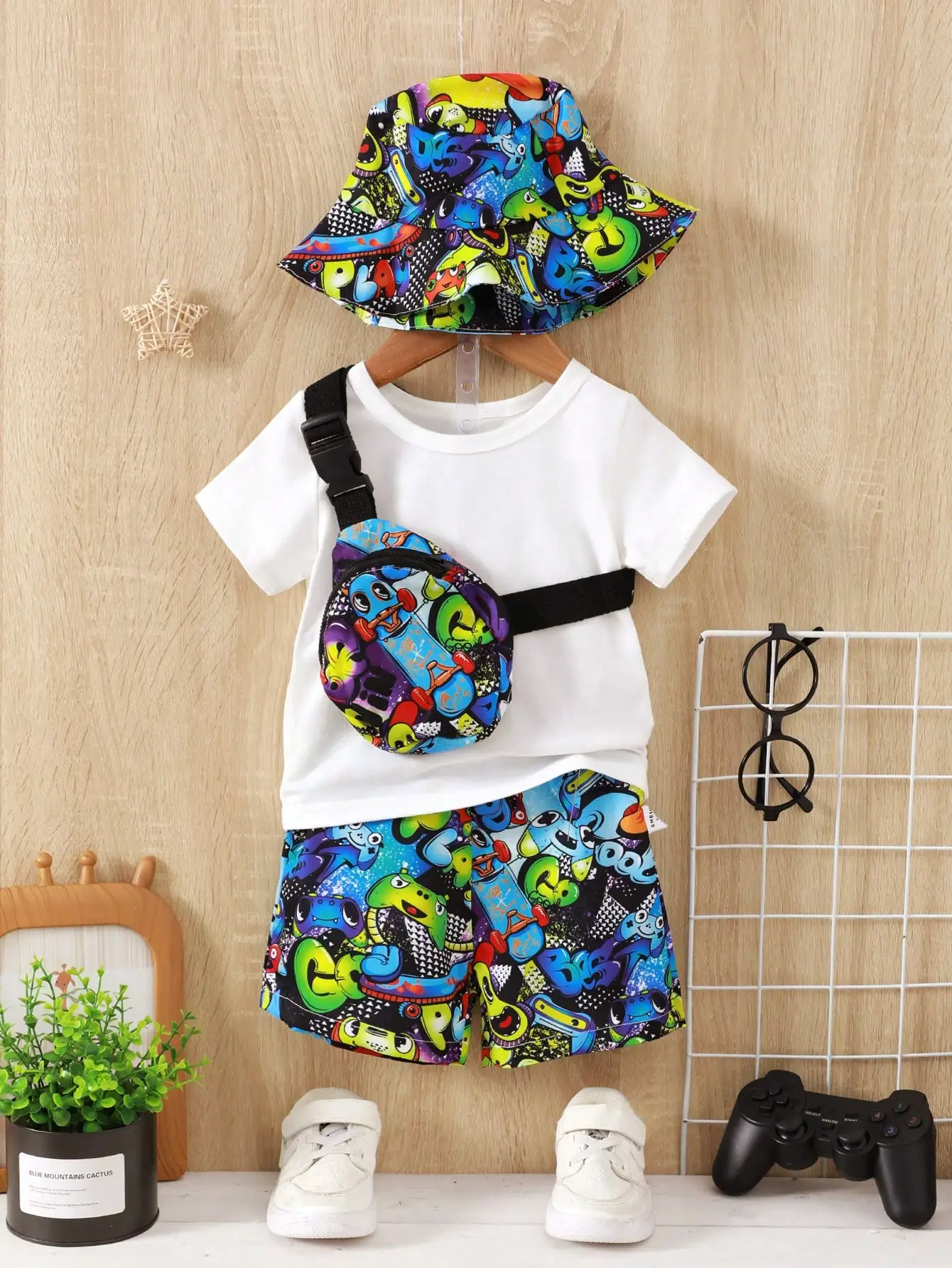 Fashion Street Style Baby Boy 4-Piece Cartoon Little Monster Printed Hat + Crossbody Bag + Pants + White Short-Sleeved T-Shirt