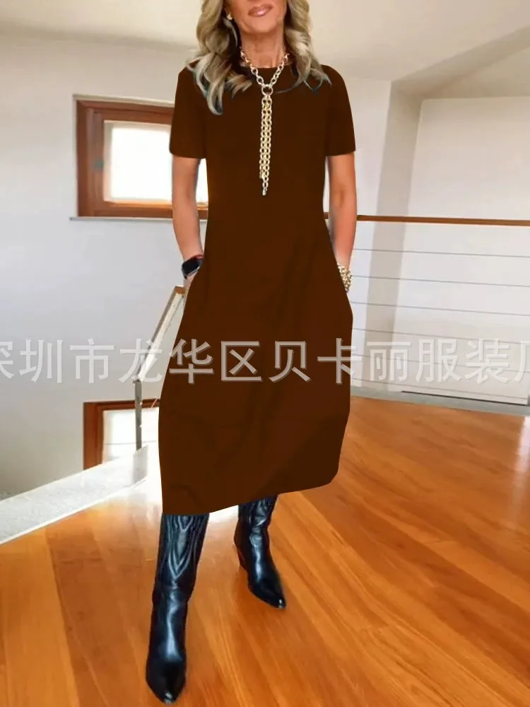 فستان نسائي صيفي جديد لعام 2025 فستان فضفاض غير رسمي بأكمام قصيرة ورقبة دائرية تي شيرت أنيق بلون واحد ملابس مكتب للسيدات