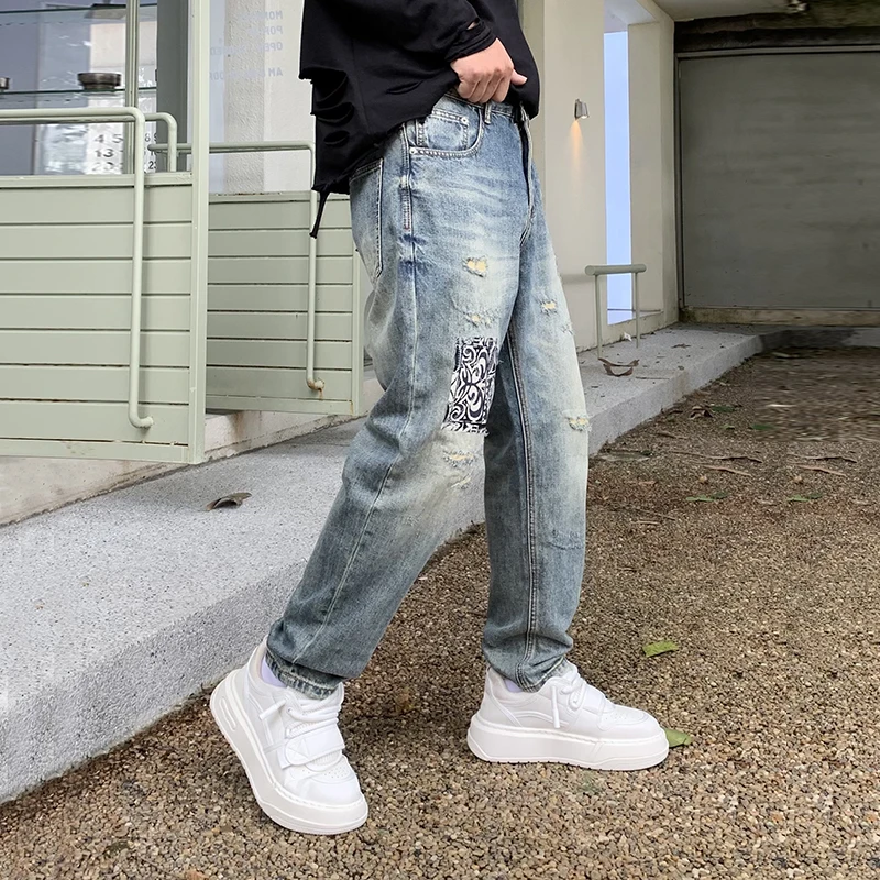 New high-end fashion tapered jeans men influx of loose pants personalized scraping hole patches Harlan pants men's pants