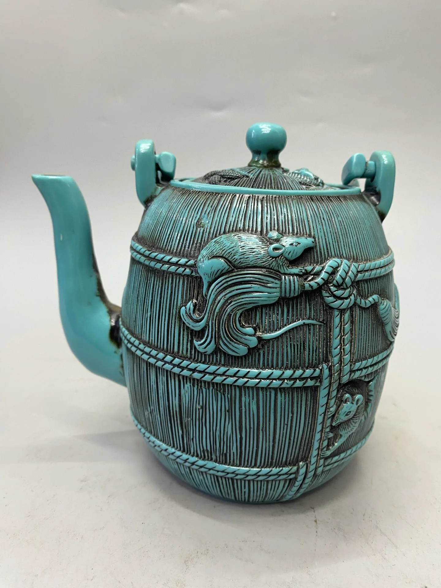 Turquoise-colored resin teapot