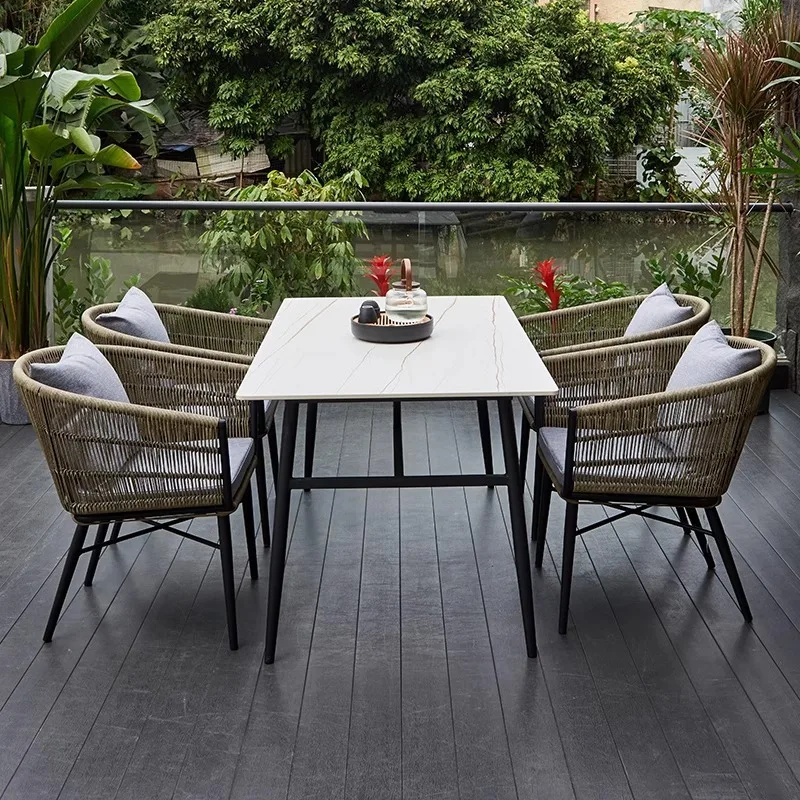 Outdoor courtyard tables and chairs High-end villa garden rattan chair rock slab furniture Outdoor waterproof and sunscreen balc
