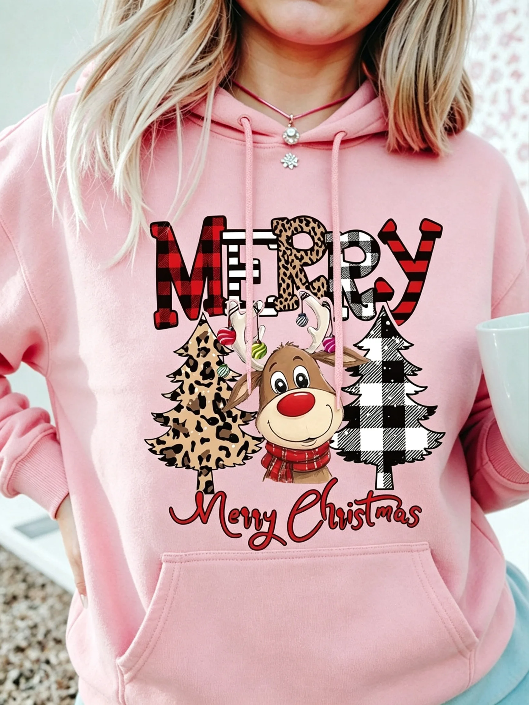 Casual women's Christmas sweatshirt stylish and cute featuring a print of a deer and leopard on Christmas tree a cartoon design