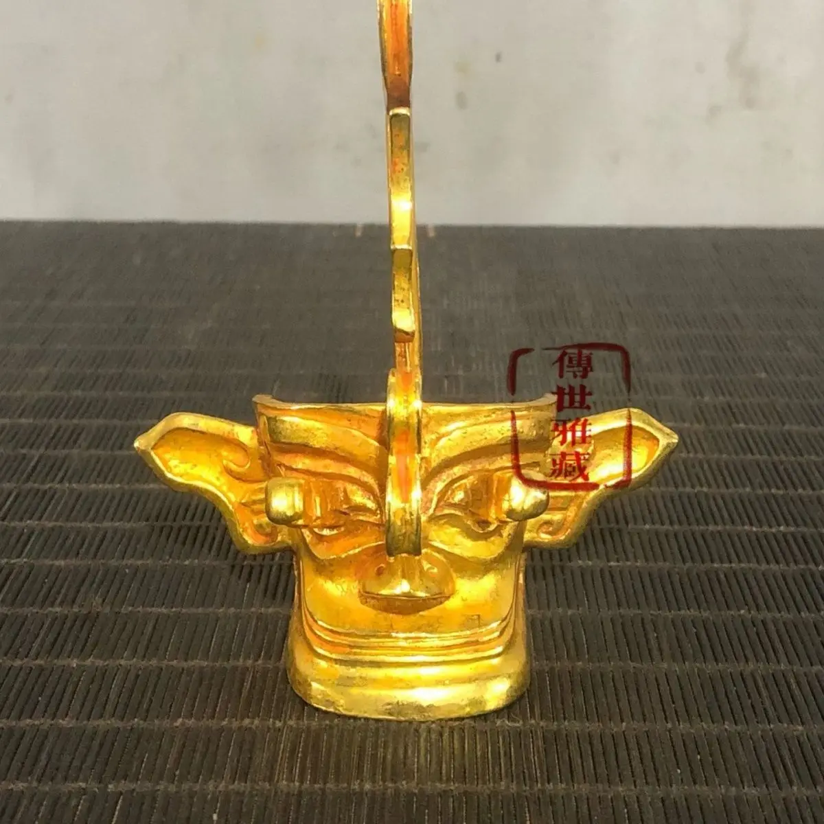 Gilded Sanxingdui Mask Ornament