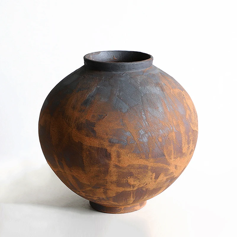 Retro, nostalgic, minimalist, modern, and tranquil style brown rough pottery jars, flower ware, and decorative decorations