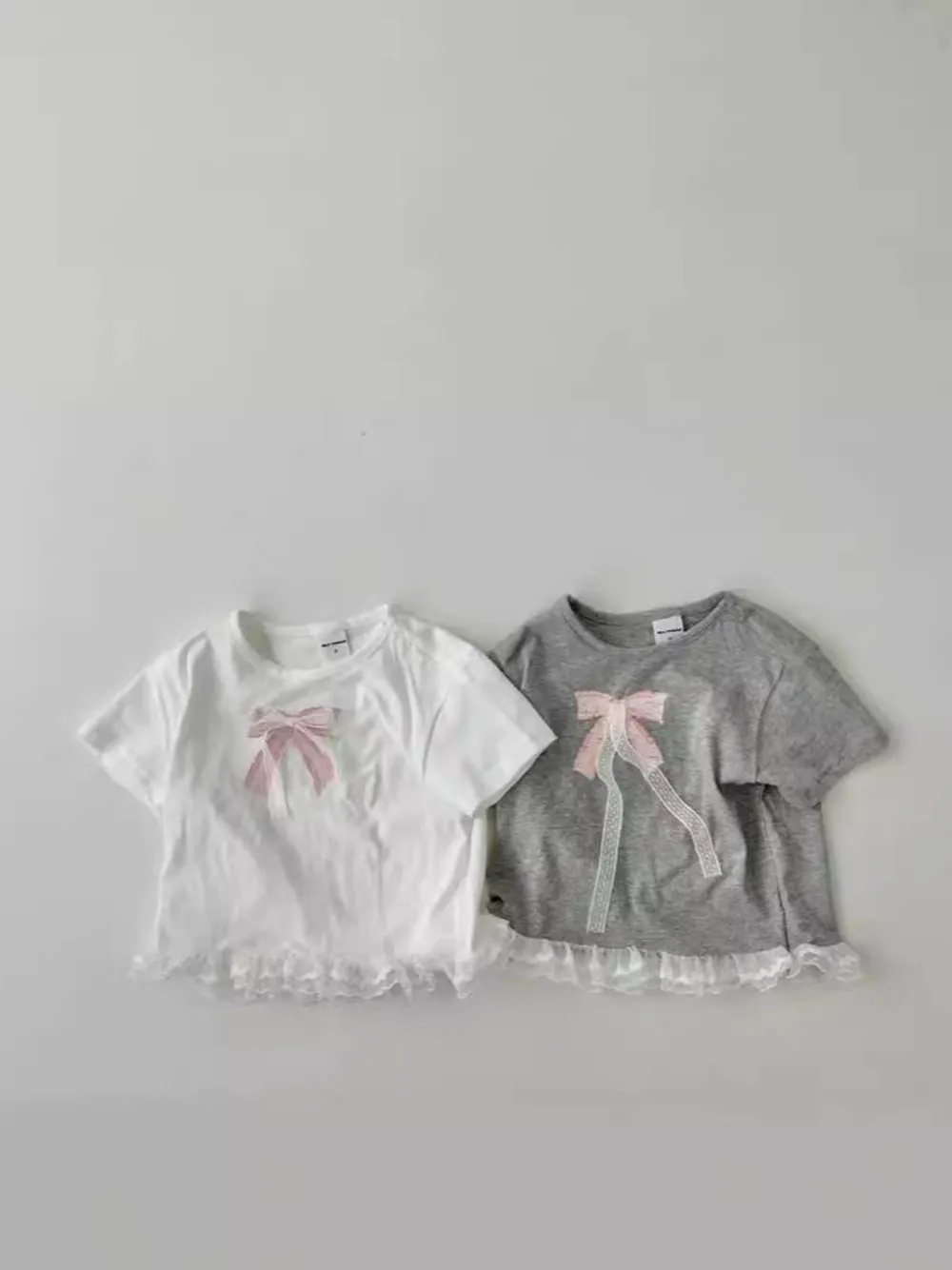 

0-4T Baby Girl's Solid Color Simple T-shirt 2024 New Summer O-Neck Fashion Sweet Bow Applique Ruffles Edge T-Shirt Simple Top