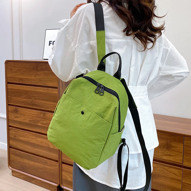 กระเป๋าเป้ไนลอนเกาหลีสำหรับผู้หญิง สีพื้นเรียบง่าย กระเป๋าเป้สะพายหลังขนาดเล็กสำหรับนักเรียนวัยรุ่น กระเป๋าเดินทาง กระเป๋าเป้สำหรับคุณแม่
