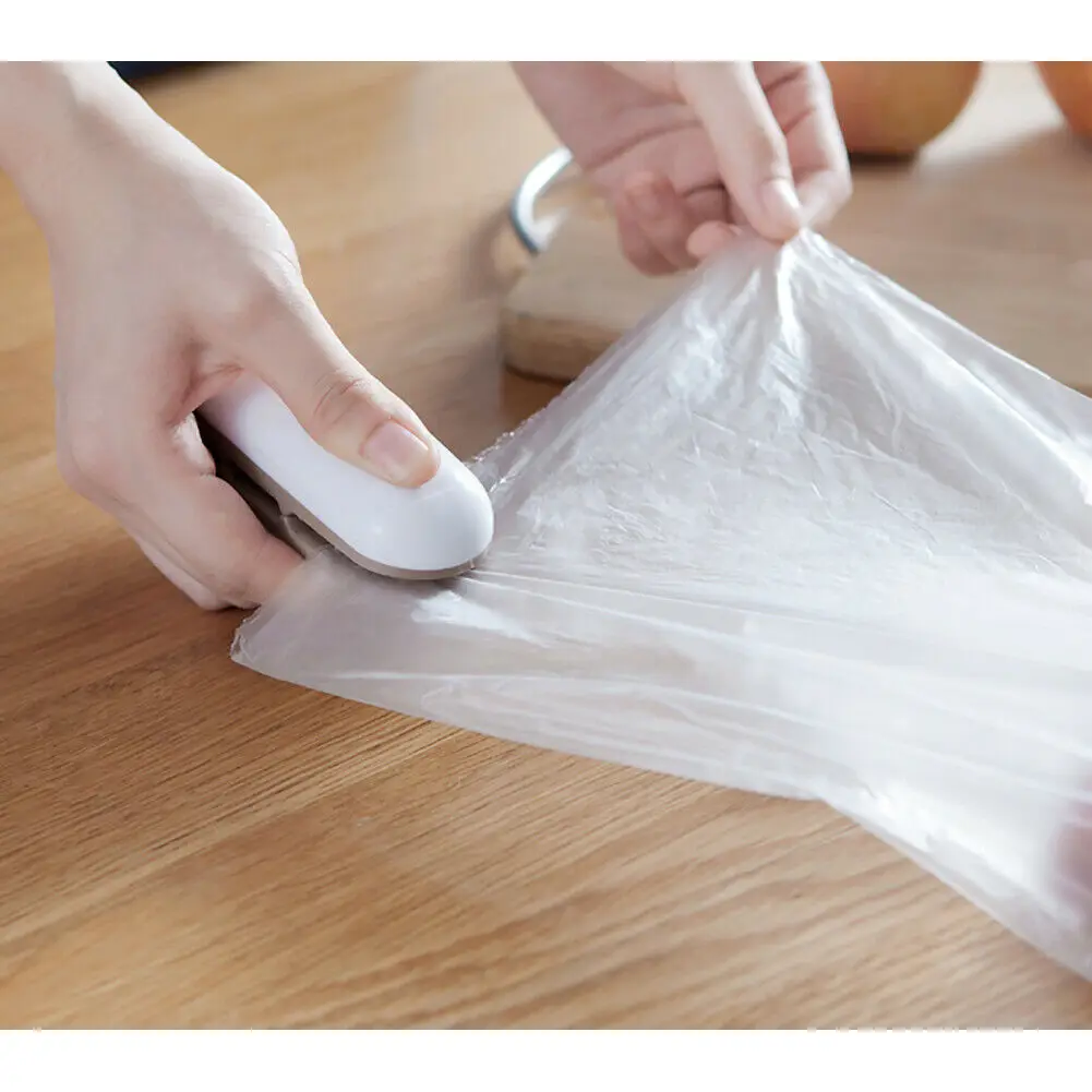 

1PCS Portable Mini Electric Heat Sealer Sealing Machine Household Plastic Bag Cutter