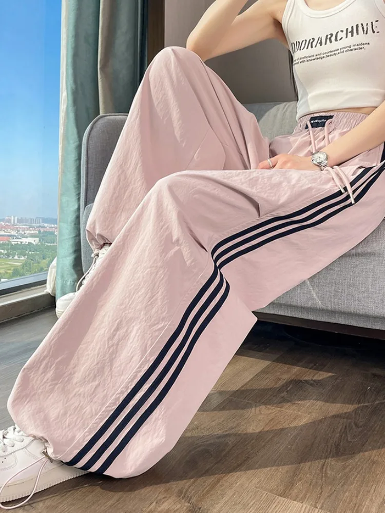 

Корейские летние женские брюки из ледяного шелка: тонкие, быстросохнущие, для работы и отдыха, с широкими штанинами и манжетами, в стиле спортивных брюк для активных девушек