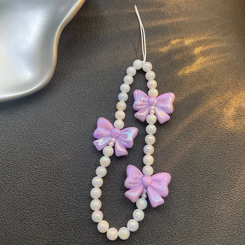 Cadena de teléfono de diseño original |   Cadena rosada del teléfono del arco de la perla, cadena CCD del teléfono del grano de la muchacha para el encanto lindo del teléfono del iPhone 17 16