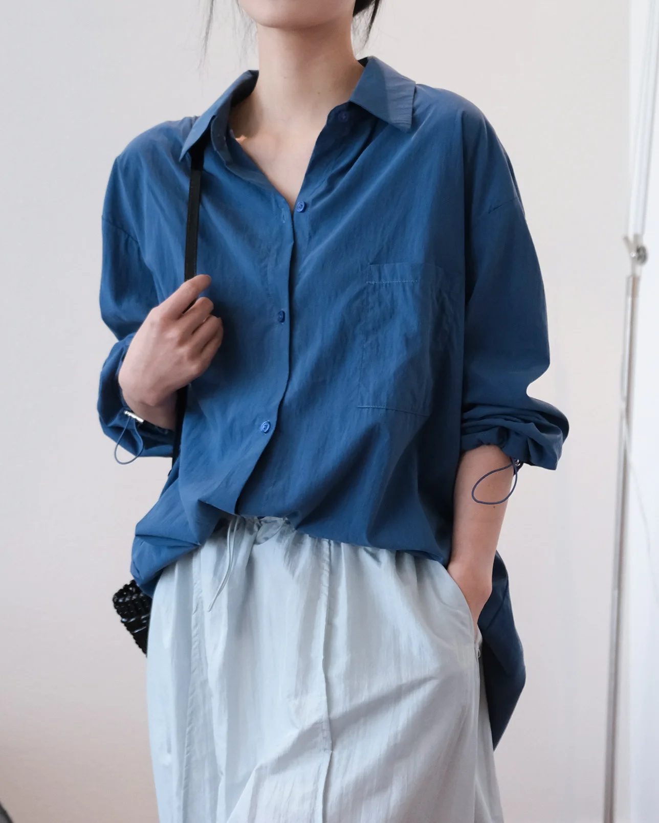 Spring and summer women's casual solid color lapel long sleeved pocket decoration loose shirt