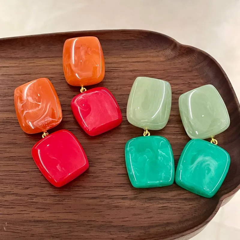 Blue, green, red and orange contrasting three-dimensional resin pendant earrings