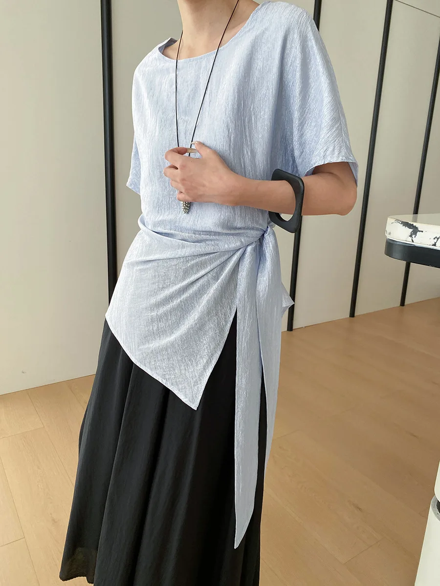 

Весенне-летняя женская повседневная однотонная рубашка с круглым вырезом, короткими рукавами и асимметричным дизайном на талии.