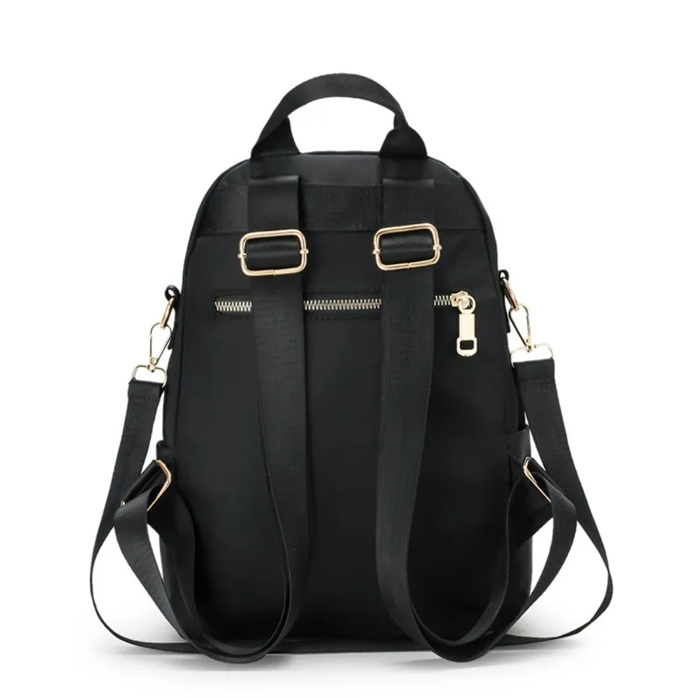 حقيبة ظهر مدرسية محمولة من النايلون بسعة كبيرة بلون سادة حقيبة كتف كاجوال متعددة الوظائف للنساء