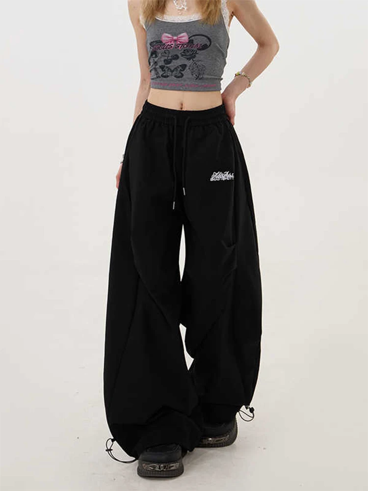 กางเกงทรงพาราชูทขาบานสไตล์ไฮสตรีทสำหรับผู้หญิง ฤดูใบไม้ร่วง-ฤดูหนาว 2025 รุ่น Y2K กางเกงขายาวทรงหลวมสไตล์ฮาราจูกุยุค 2000s แนวกรันจ์อเมริกันย้อนยุคทรงบอยแบงค์