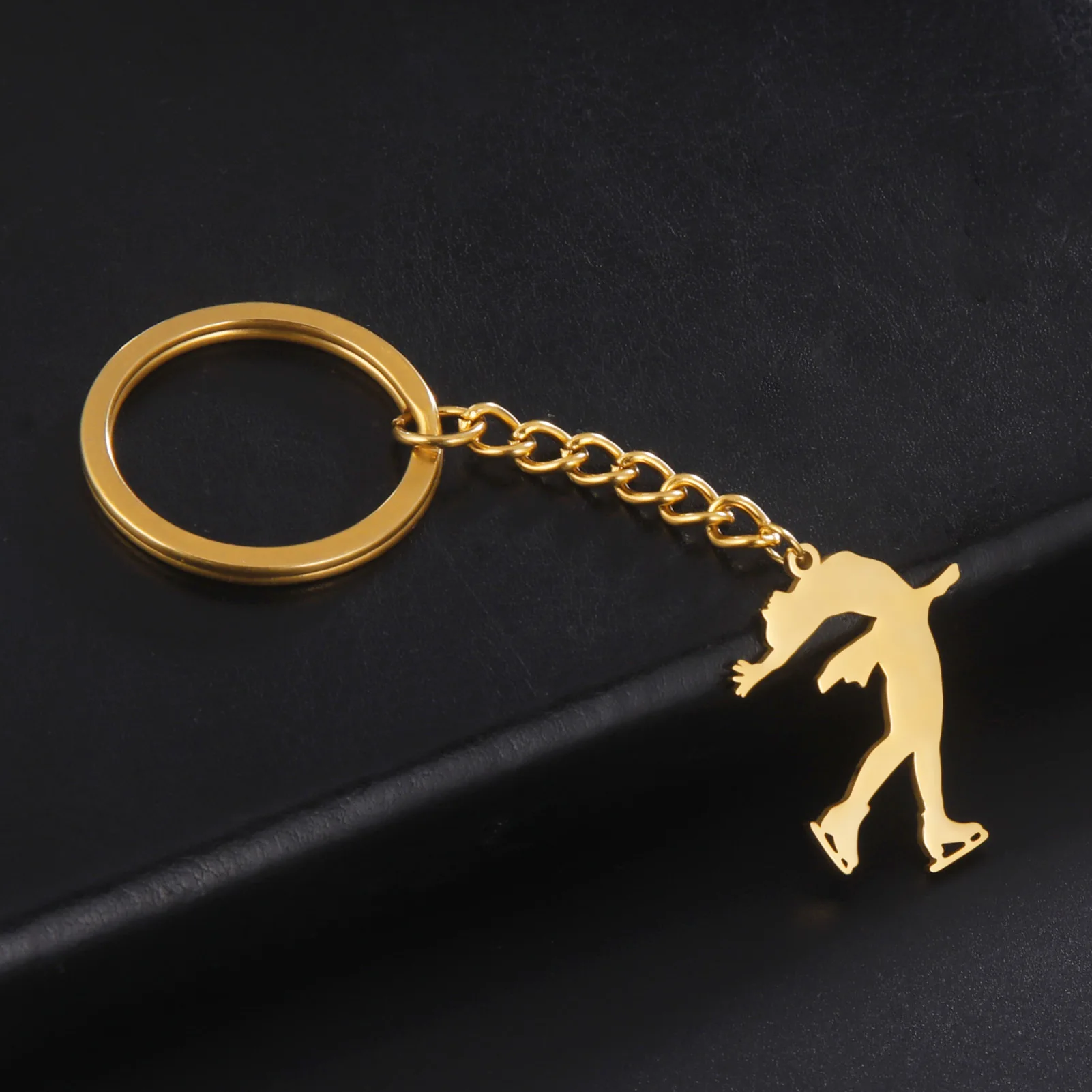 New fashion cut titanium steel chain key chain Figure skating style Smooth pendant sports commemorative stainless steel key chai