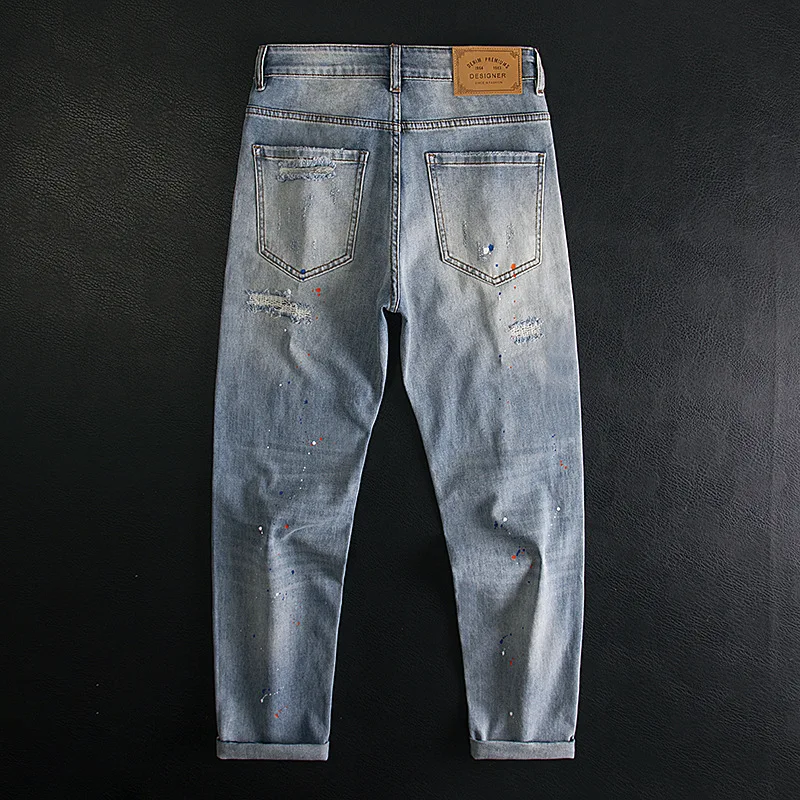 Splash ink ripped jeans for men, slim fit with small feet, elastic and scraped patch design, spring/summer 2025 new pants