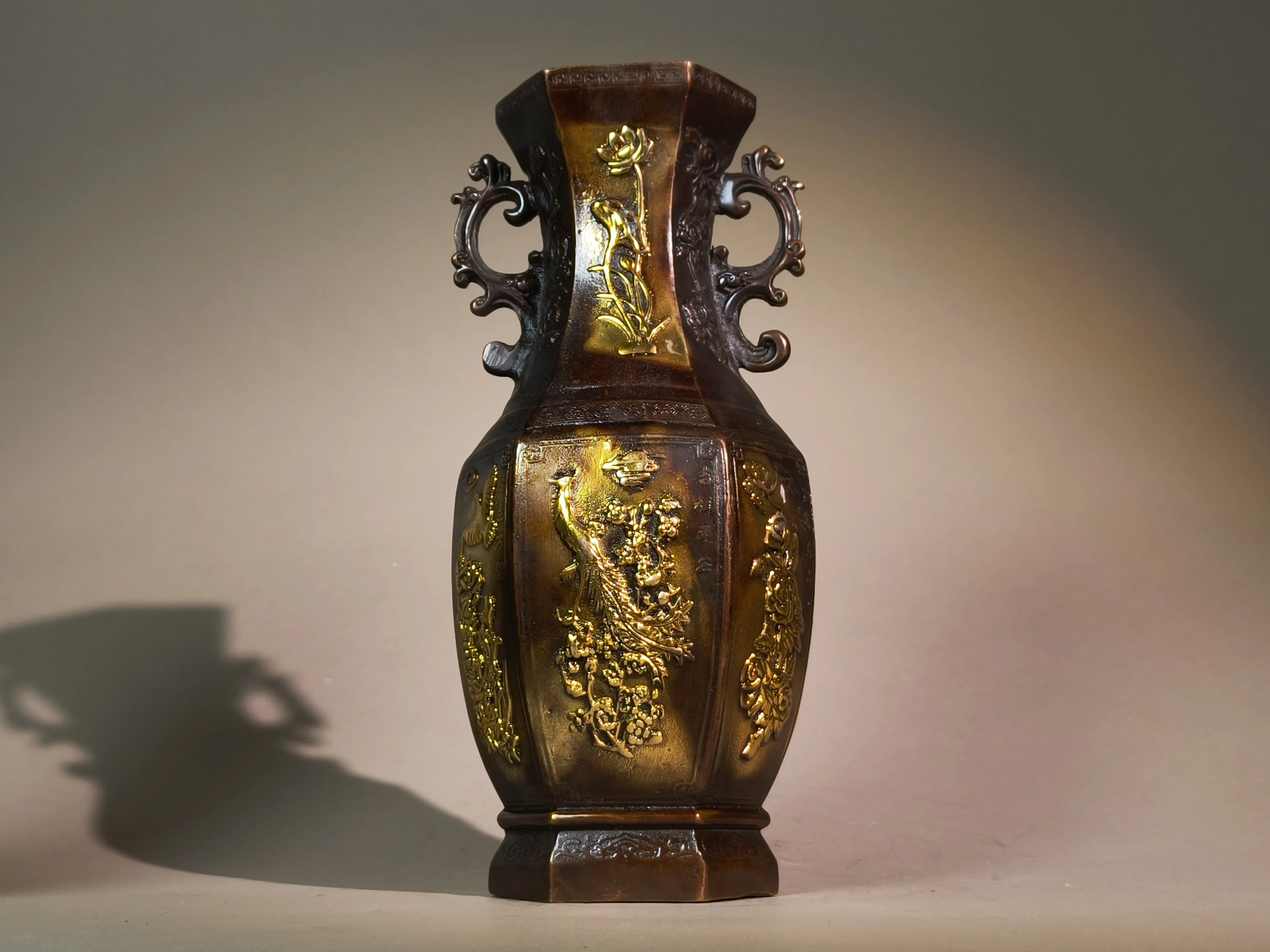 A pair of exquisitely hand-carved vintage bronze vases engraved with phoenix and peony patterns, antique collectible ornaments f