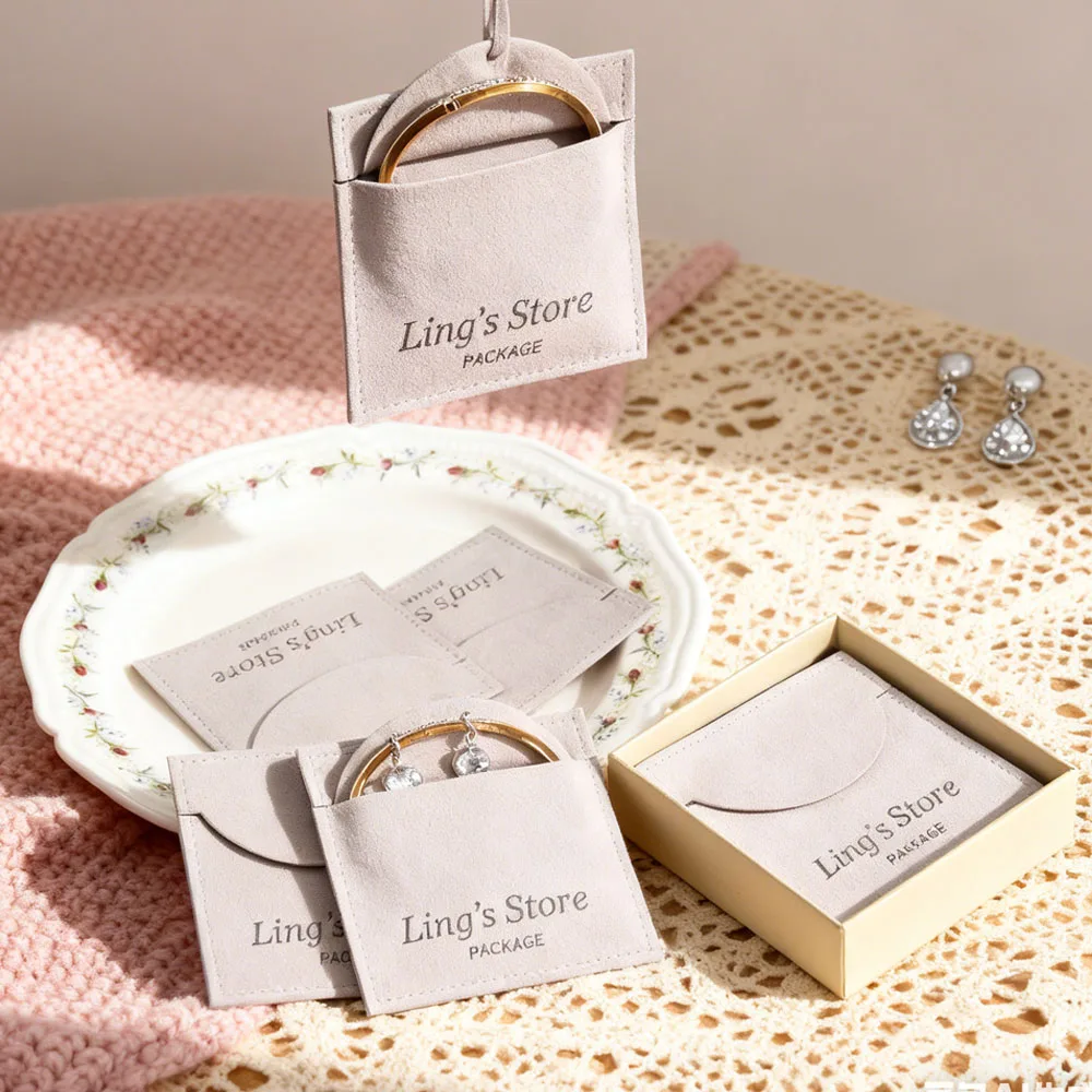 

100 шт., роскошный индивидуальный логотип, серый подарочный пакет, конверт, парфюмерный брелок для ресниц, масло, USB-гарнитура, нож, органайзер, сумка