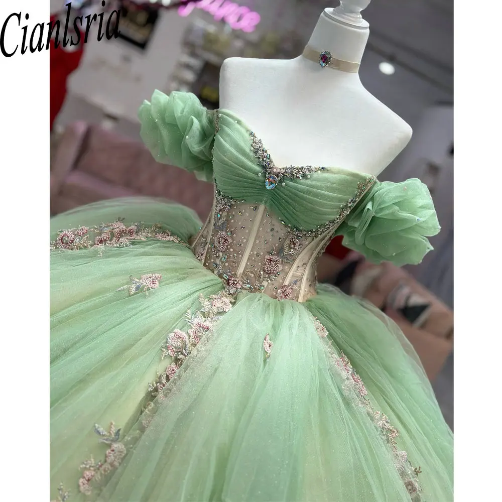 

Sage Green Illusion Beading Crystal Ball Gown Quinceanera Dresses Off The Shoulder Pink Appliques Corset Vestido De 15 Anos