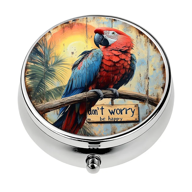 A travel-friendly pill box, single compartment, with three sections, designed with a parrot pattern. This compact pill box is a decorative metal case, suitable for carrying medication and vitamins.