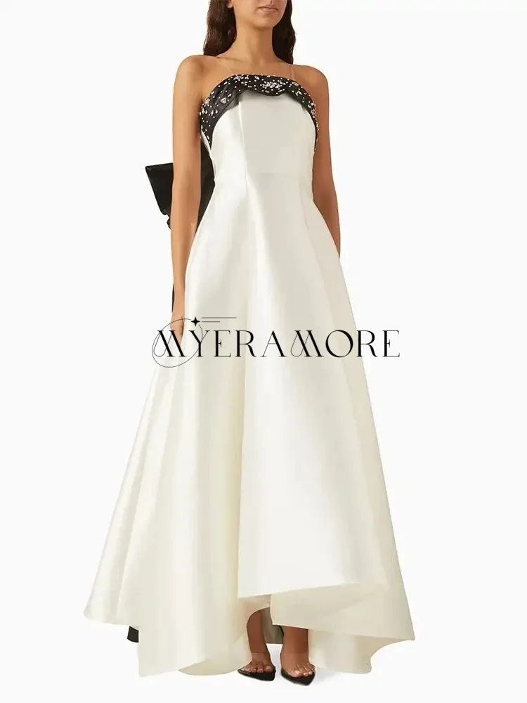 Luxuriöse Abendkleider in Kontrastfarbe, elfenbeinfarben, schwarz, trägerlos, mit Perlen besetzt, mit Schleife und Falten, individuell gestaltet