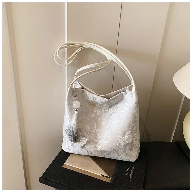 Bolso de mano de cuero de diseñador famoso para mujer, bolso de viaje elegante con detalles clásicos a la moda de marca de lujo ​