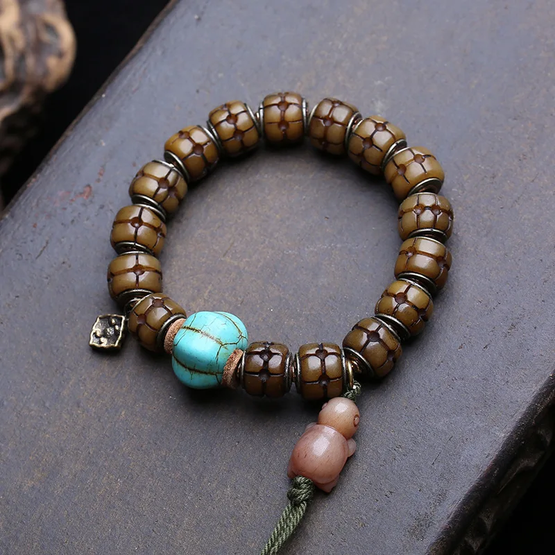 Single-Loop Bracelet With Inlaid Turquoise, Bone, And-Shaped Side-Hanging Copper Accessory