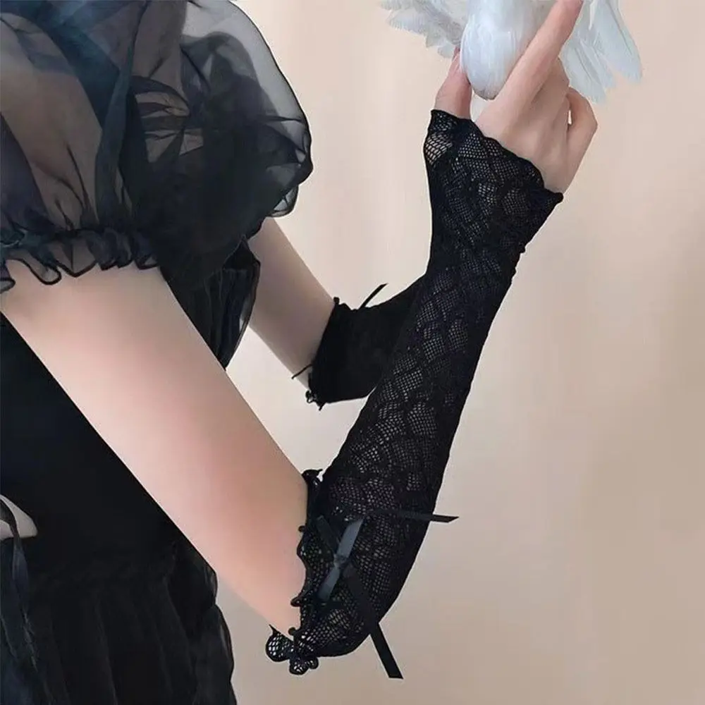 ถุงมือลูกไม้สไตล์พังก์ โลลิต้า แต่งระบาย ผ้าตาข่ายสีดำขาว Y2k ถุงมือแบบไม่มีนิ้ว ป้องกันรังสียูวี แต่งโบว์ผูกเชือก สำหรับผู้หญิงและเด็กผู้หญิง