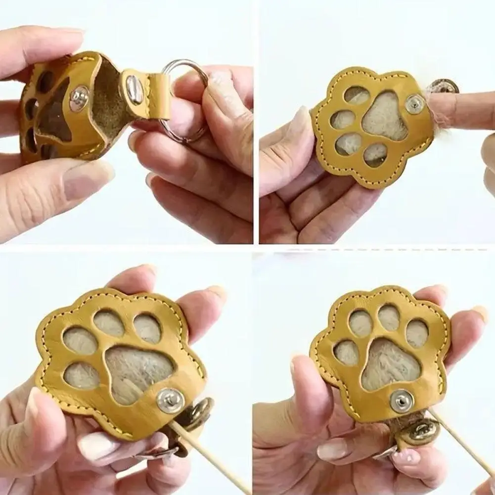 สัตว์เลี้ยงผมเก็บพวงกุญแจหนังสัตว์เลี้ยงผมพวงกุญแจน่ารัก Cat PAW Design Creative PET Hair Storage แคปซูลแบบพกพาอุปกรณ์เสริม