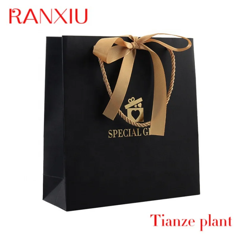 Bolsa de compras de papel de regalo de color de lujo personalizada con su propio logotipo, bolsas de papel kraft negras con asa