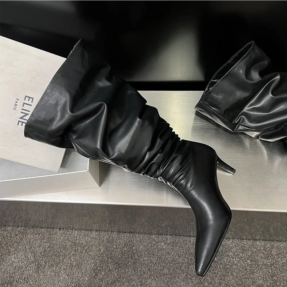 أحذية بأرجل بنطلون من جلد البقر لعام 2025 بمقدمة مدببة وكعب سحب على الكعب فوق الركبة أحذية نسائية