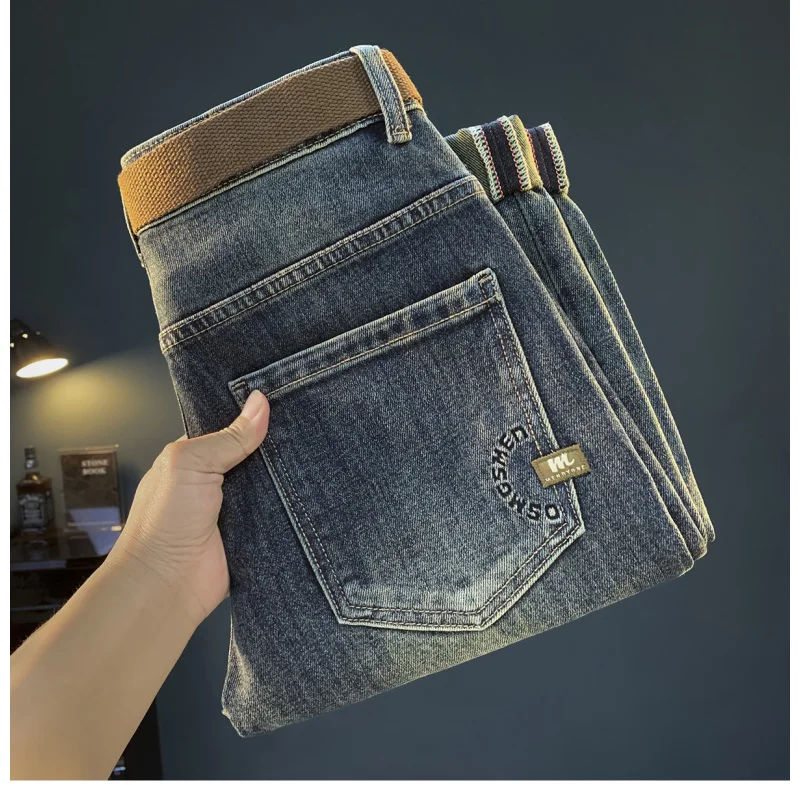 Luksusowe jeansy męskie na jesień i zimę, grube, elastyczne, w stylu retro, niebieskie, z wąską nogawką, lekko rozszerzane męskie spodnie.