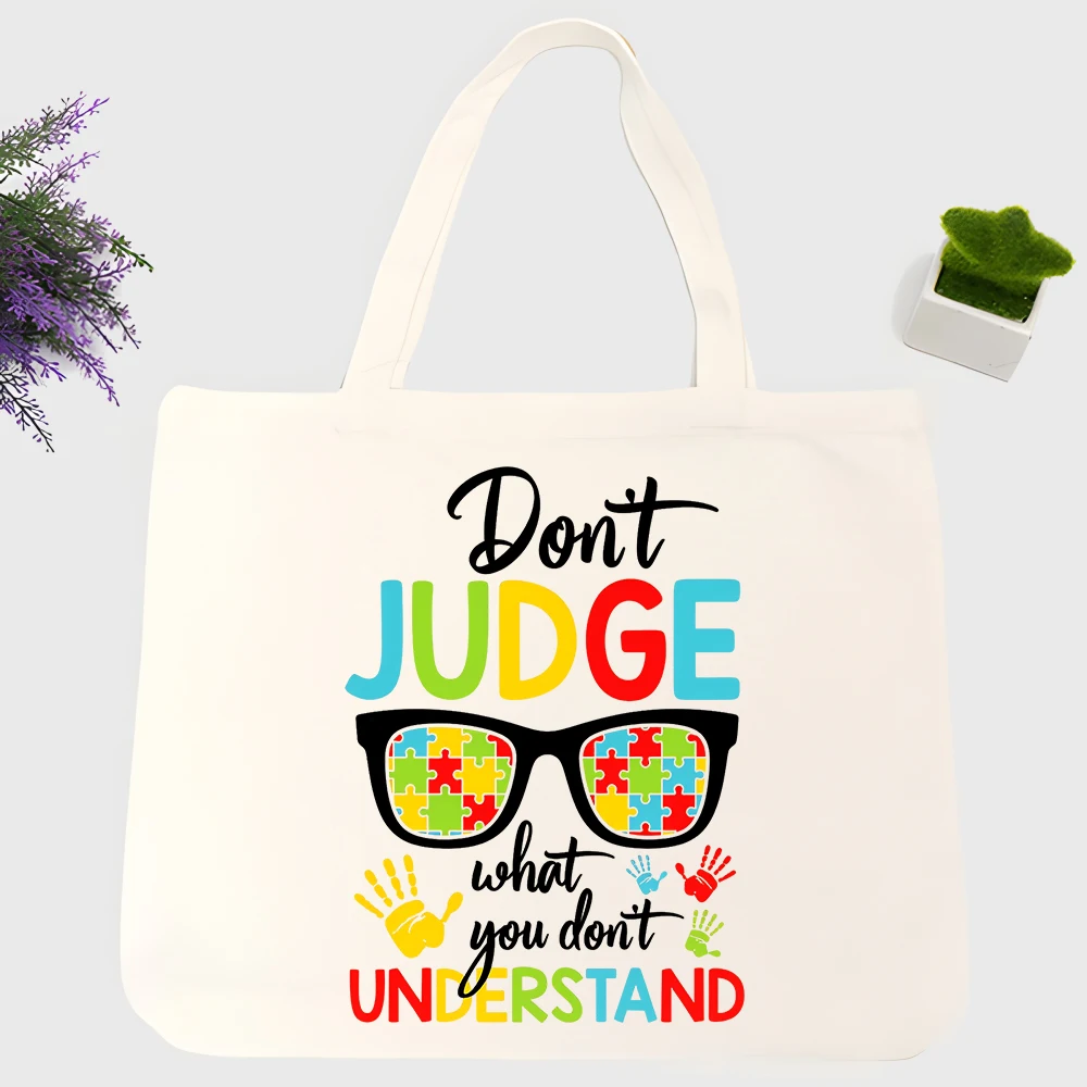 Unisex slogan-style canvas tote bag with puzzle piece graphic, casual daily shopping and streetwear use
