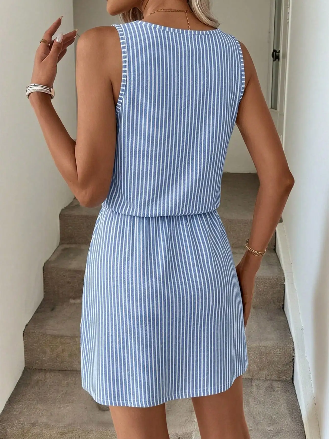 Elegant women's striped sleeveless cold-shoulder dress with tie detail. Perfect for travel, dates, vacation, office wear and dai