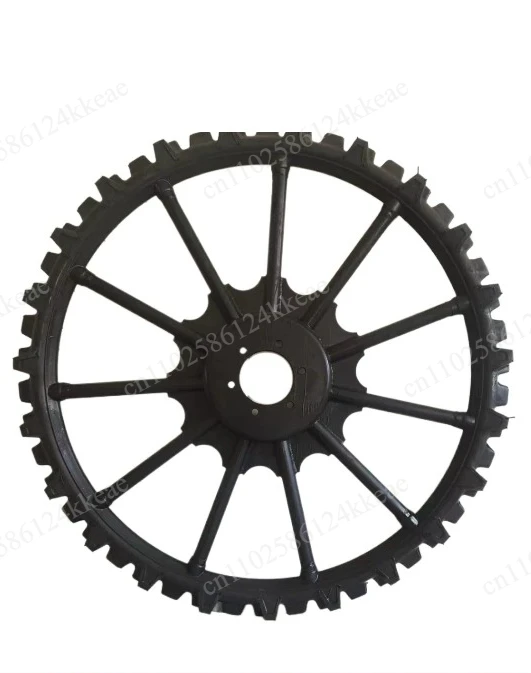 Hand-held small four-wheel tractor modified with raised tires, fertilized solid narrow wheels