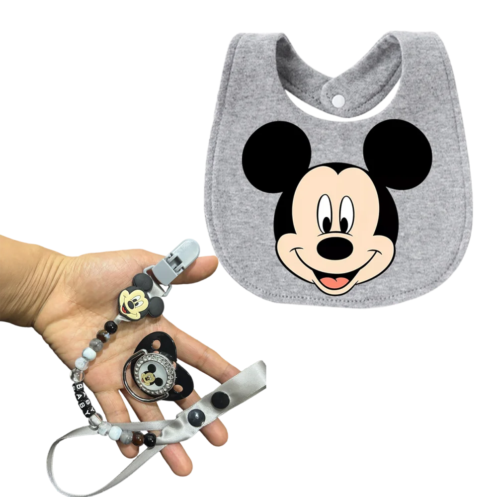 

Набор детских пустышек с изысканными мультяшными рисунками. Подарочный набор для новорожденных: нагрудник, пустышка и держатель для пустышки. Подходит для младенцев.